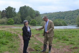 Bill Wiggin MP and HWT Chief Executive Helen Stave cutting the ribbon at new reedbed site.
