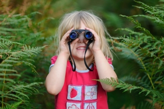Young girl with binoculars
