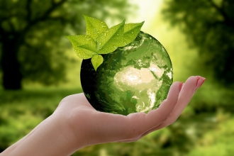 Image of a globe held in a person's hand