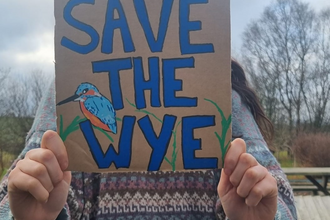 Woman with placard saying 'save the wye'