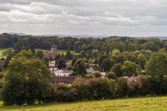 View over village nestled in trees