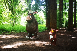 Large wooden sculptures of the Gruffalo and Gruffalo's child in the redwoods at Queenswood Country Park