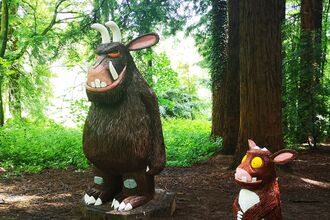 The Gruffalo and Gruffalo's Child carved wooden sculptures amongst the redwoods at Queenswood Country Park