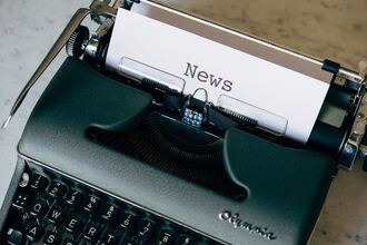 Typewriter with 'news' page inserted