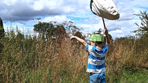 Boy with sweep net at Bartonsham Meadows
