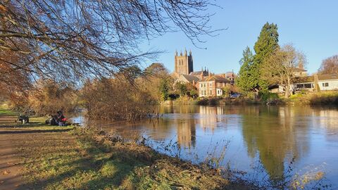 View of river with cathedral and other buildings on far bank