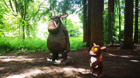 Large wooden sculptures of the Gruffalo and Gruffalo's child in the redwoods at Queenswood Country Park