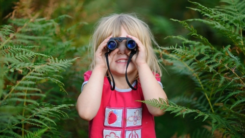 Young girl with binoculars