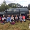 volunteers sat in front of vehicle 