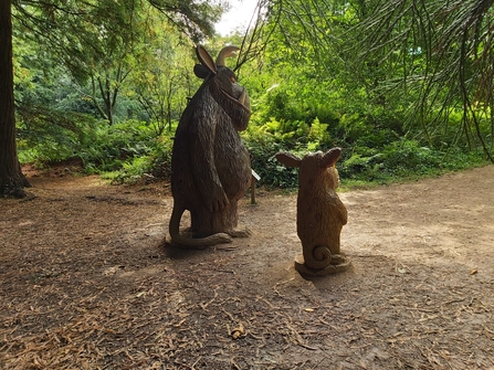 Sculptures of Gruffalo and Gruffalo's Child in woodland