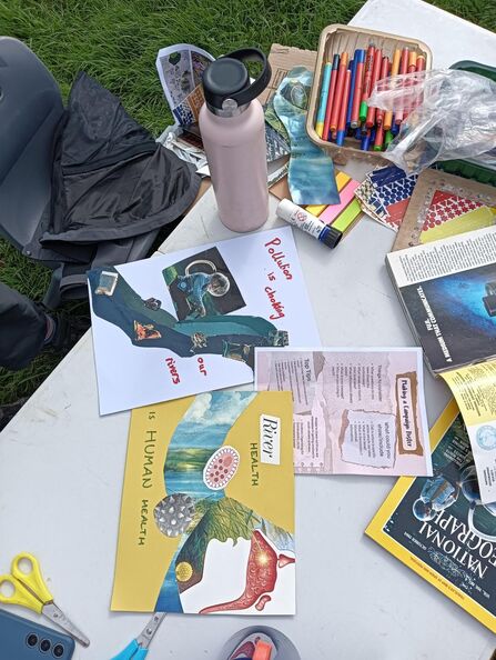 Image of table with art materials and collage artwork about river health