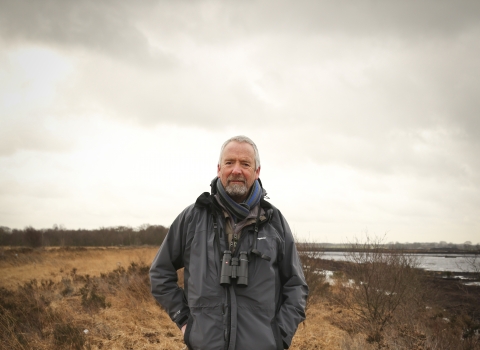 Dave stands on a nature reserve