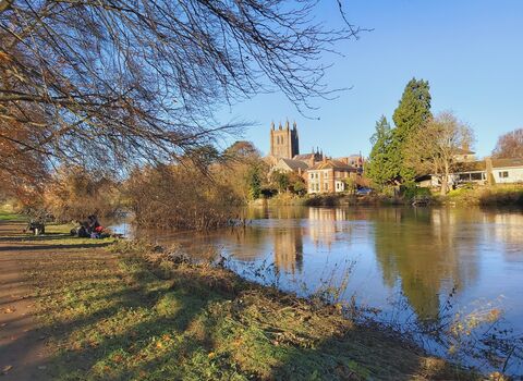 View of river with cathedral and other buildings on far bank